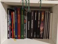 Third shelf of the BILLY containing Forbidden Lands, Shadowdark and Ironsworn